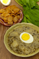 Sorrel soup with egg and greens. Selective focus.