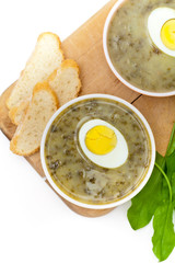 Sorrel soup with egg and greens. Selective focus.