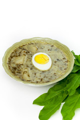 Sorrel soup with egg and greens. Selective focus.