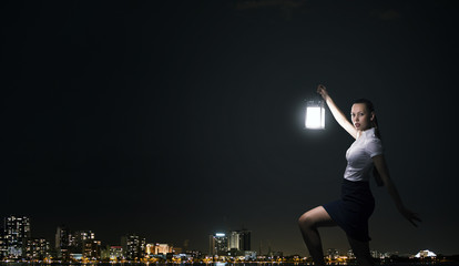 Fototapeta na wymiar Businesswoman with lantern
