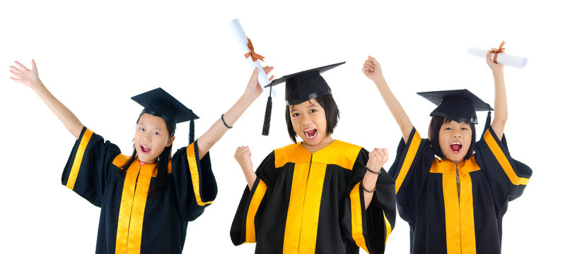 Group of excited asian school kids in graduation gown