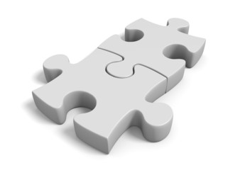 Two jigsaw puzzle pieces locked together in a connected position