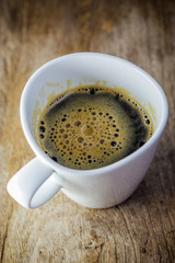white cup. Cup Of Coffee on wooden table