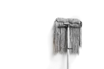 dirty mop isolated on white background