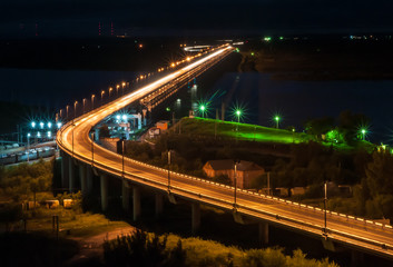 Fototapeta na wymiar Night View of the Khabarovsk Bridge across the Amur River