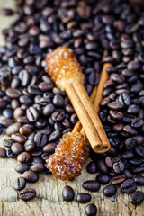 Sugar Stick Cinnamon and coffee bean on wooden table