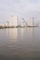 Naklejka premium tall buildings near the river in Bangkok of Thailand