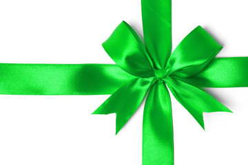 Shiny green satin ribbon on white background