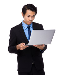 Asian Businessman use of notebook