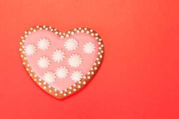 Heart cookie on red
