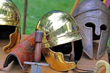 sword and helmets of ancient Roman origin and medieval helmets o