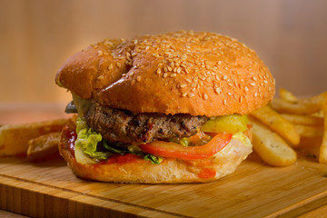 Tasty burger with melted cheese and thick succulent ground beef