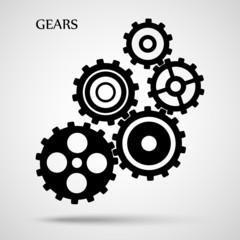 Black toothed gears ( cogs ) is meshed on gray background
