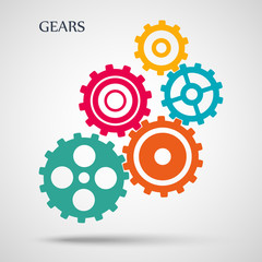 Colorful toothed gears (cogs) is meshed on gray background