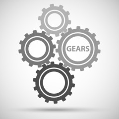 Toothed gears (cogs) is meshed on gray background