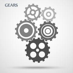 Gray toothed gears ( cogs ) is meshed on gray background