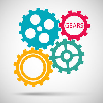 Color toothed gears (cogs) is meshed on gray background
