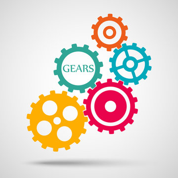 Colored toothed gears (cogs) is meshed on gray background