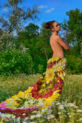 girl in the dress of the firebird of flowers