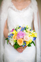 bride holding a wedding bouquet. Wedding flowers closeup