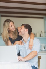 Cute couple using laptop together