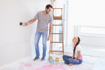 Cute couple redecorating living room