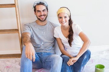Cute couple redecorating living room