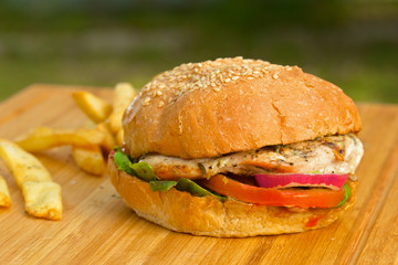 Tasty burger with melted cheese and thick succulent ground beef