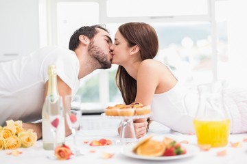 Obraz na płótnie Canvas Young couple having a romantic breakfast