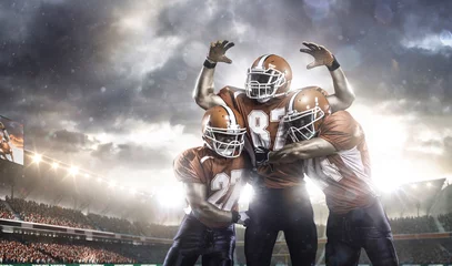 Tuinposter American football players in action on stadium © 103tnn