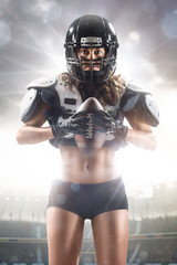 American football female player is posing