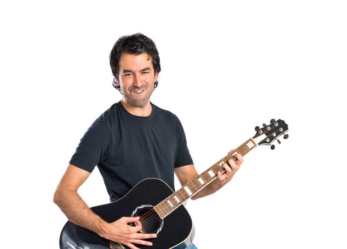 Handsome Man With Guitar Over White Background