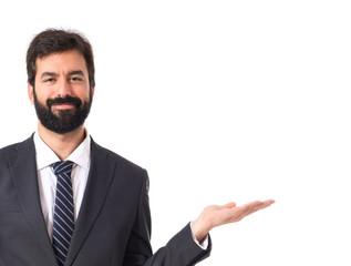 Businessman presenting something over isolated white background