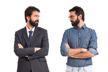 Brothers with his arms crossed over white background