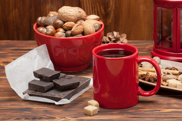 Mug Of Tea Or Coffee. Sweets And Spices. Bowl Of Nuts. Christmas