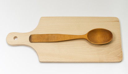 One wooden spoon on the board