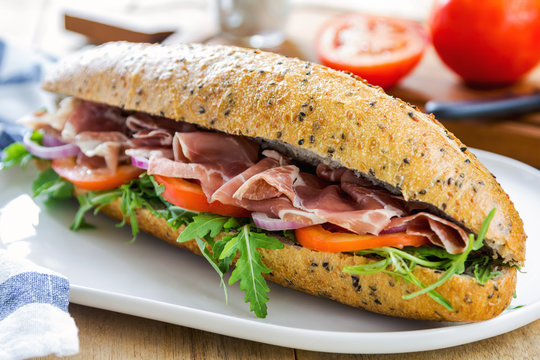 Prosciutto with rocket on sesame baguette