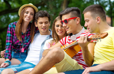 Group of friends playing music