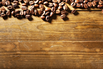 Coffee beans on wooden background