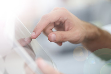 Fototapeta Closeup of hand sliding on digital tablet obraz