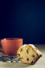 cup of green tea with cake on burlap background
