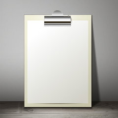 Blank white paper sheet in a clipboard of standing on the table