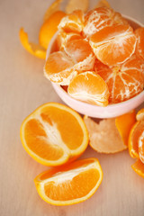 Plakat Sweet tangerines and oranges on table close-up