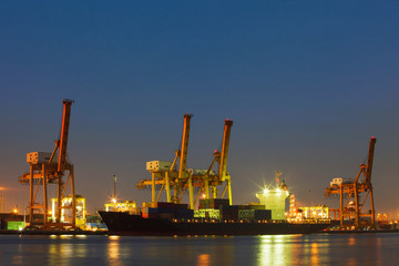 Fototapeta premium beautiful lighting of freight container comercial ship with ship
