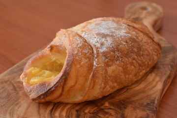 Fresh baked croissant with vanilla filling
