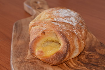 Fresh baked croissant with vanilla filling
