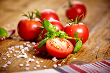 Tomatoes lying on old table. Diet food