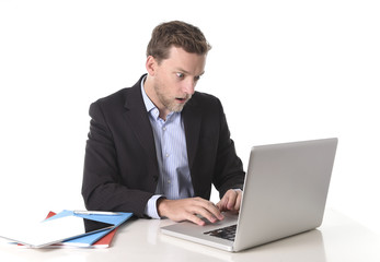 attractive businessman working in shock at office