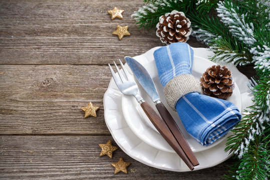 Christmas table setting on a wooden background, horizontal