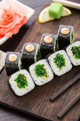 Sushi rolls with chuka salad